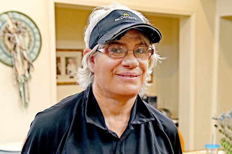 Lady wearing glasses working at Food Service