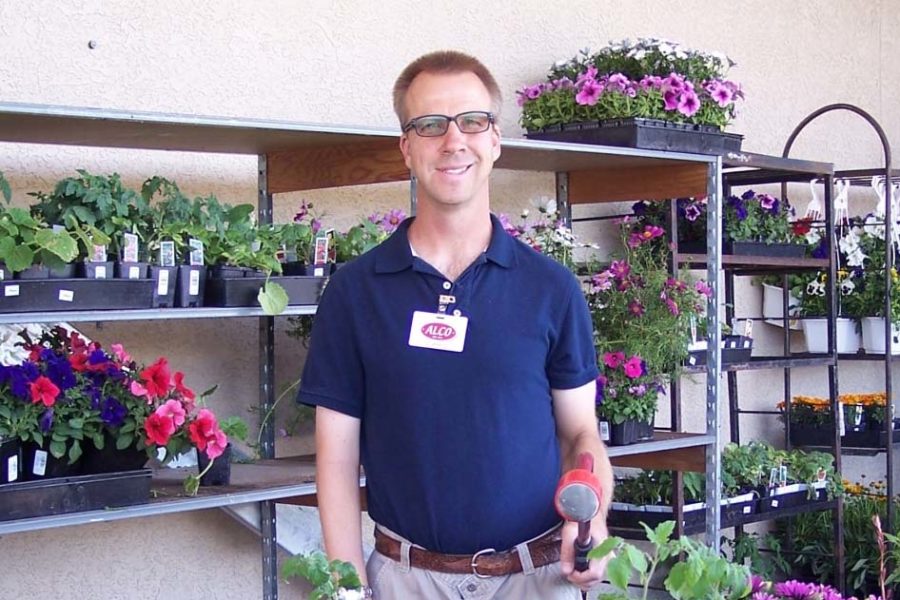 Man wearing glasses working at a flower shop