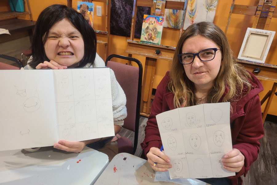 Resident ranchers show off their art work during the drawing class offered in the academy