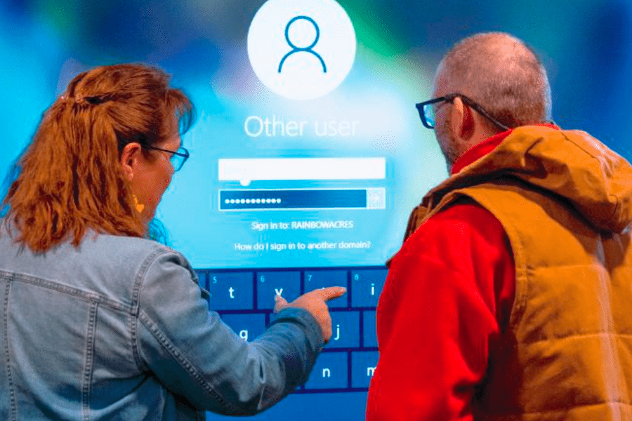 As part of the Rainbow Academy, instructors teach the resident Ranchers to use Smartboards. Here, Diane is teaching a resident to type on the touch screen surface of the Smartboard.