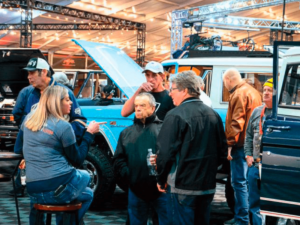 Neurodiverse adult residents of Rainbow Acres in Arizona attend a car event off site