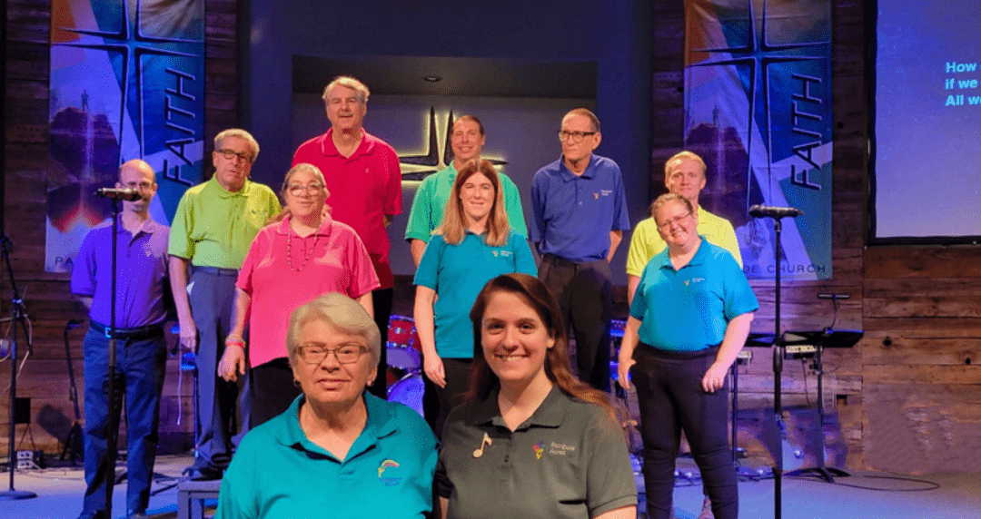 Rainbow Acres Ranchers Choir Performing at Church Event Rainbow Acres Ranchers and staff stand together on a church stage during a choir performance, reflecting faith, community, and creative expression within the Rainbow Acres program.